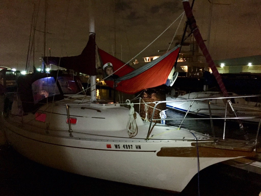 My son relaxing on Tulia as she sits in the water.